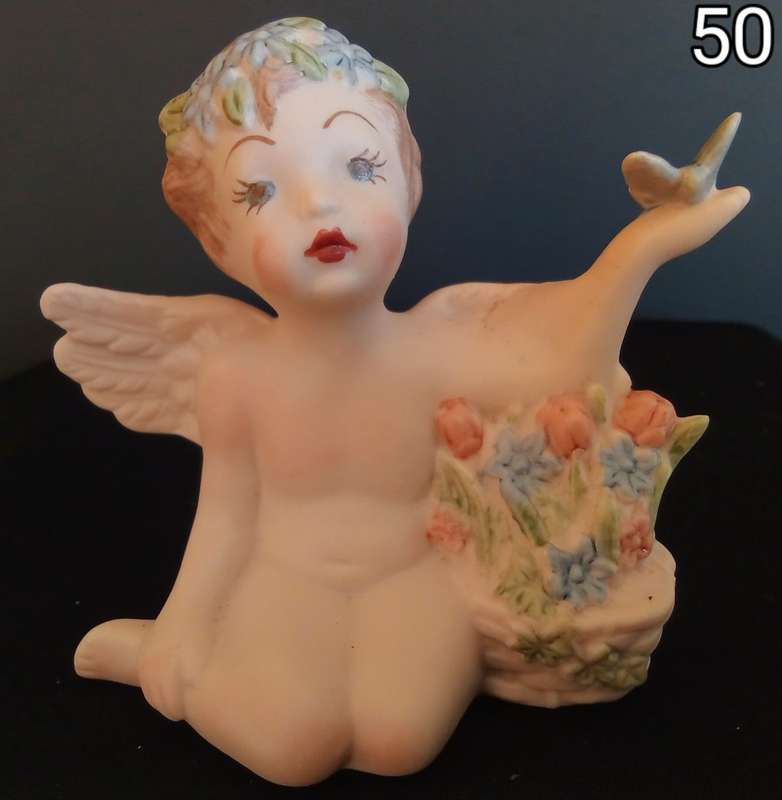Beautiful hand painted porcelain Angel with butterfly