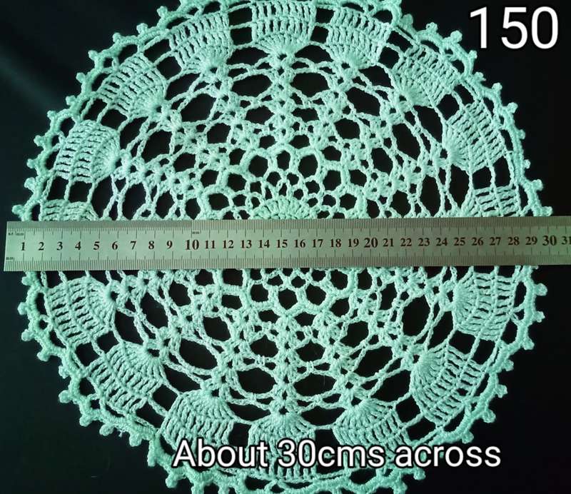 Beautiful green crocheted doily - about 30cms across