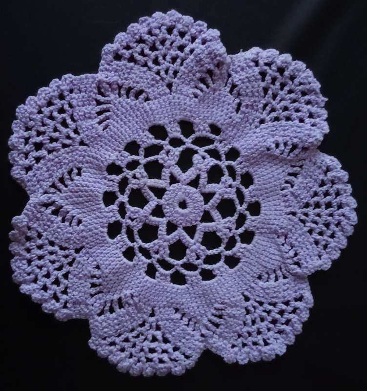 Beautiful light purple crocheted doily - about 24cms across