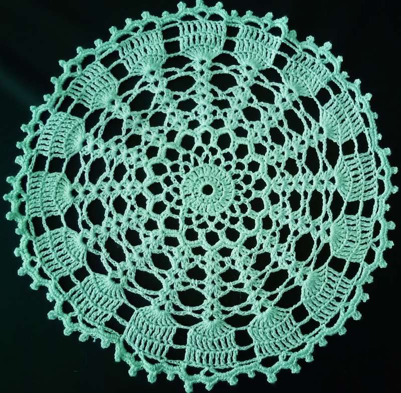 Beautiful green crocheted doily - about 30cms across