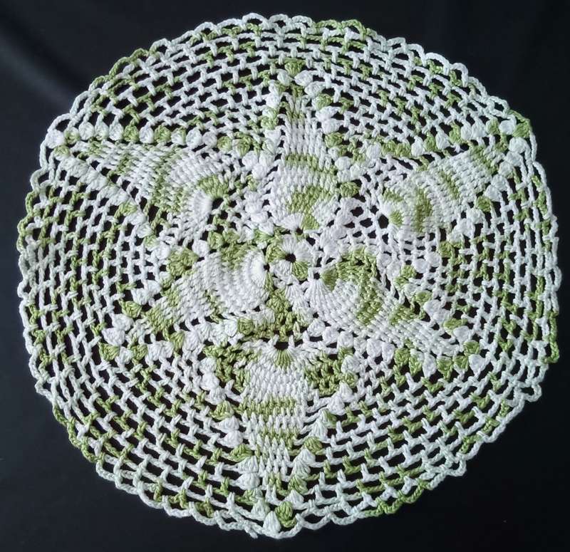 Beautiful white and green crocheted doily - about 30cms across