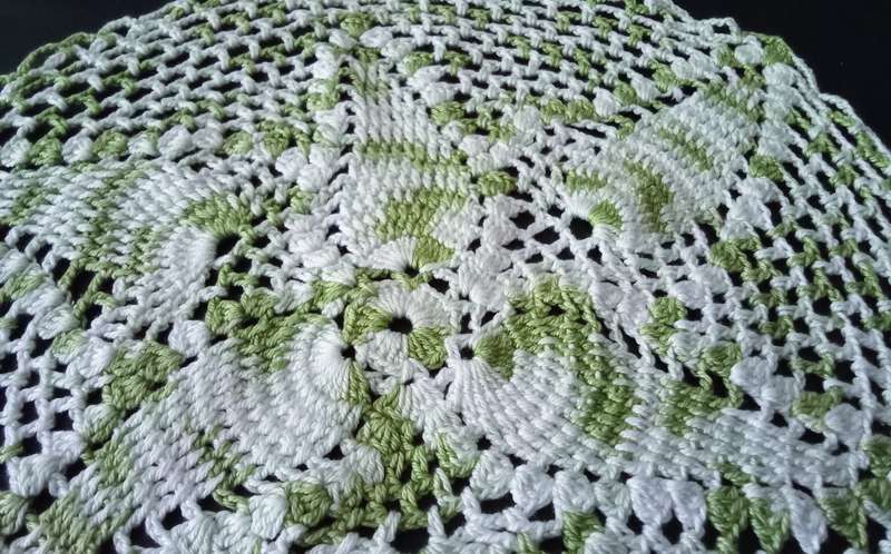 Beautiful white and green crocheted doily - about 30cms across
