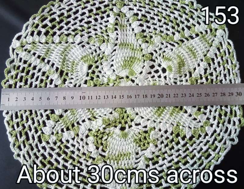 Beautiful white and green crocheted doily - about 30cms across