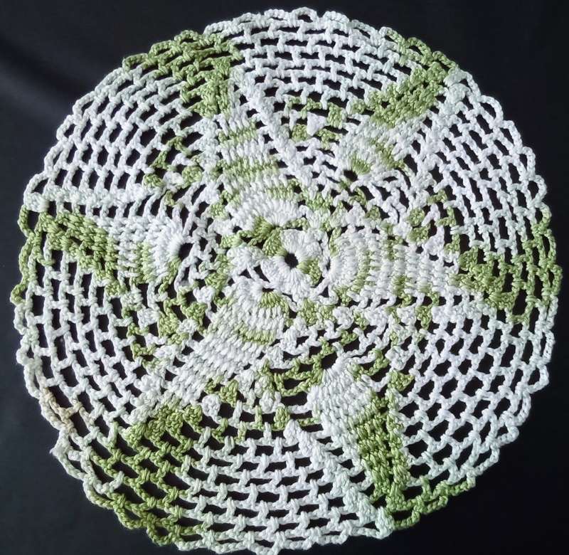 Beautiful white and green crocheted doily - about 25cms across