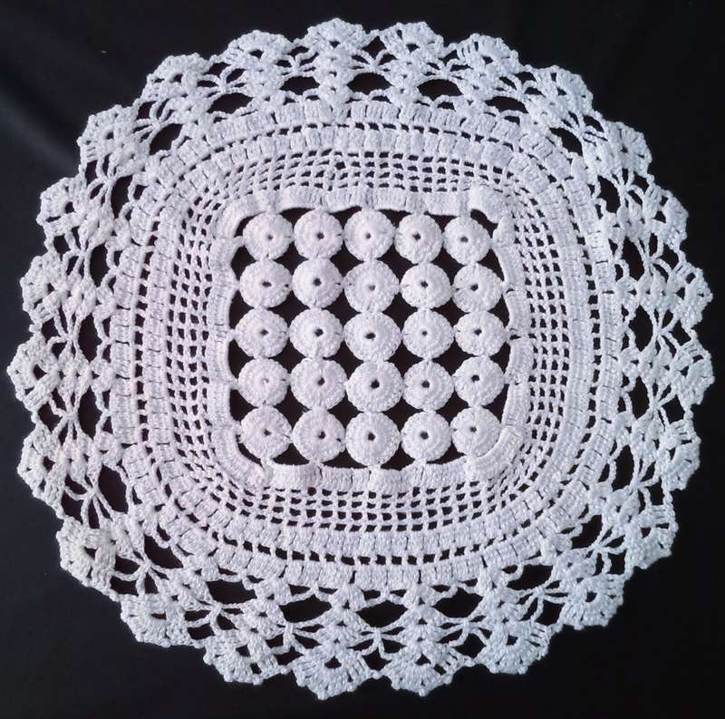 Exquisite white crocheted doily - about 38cms across