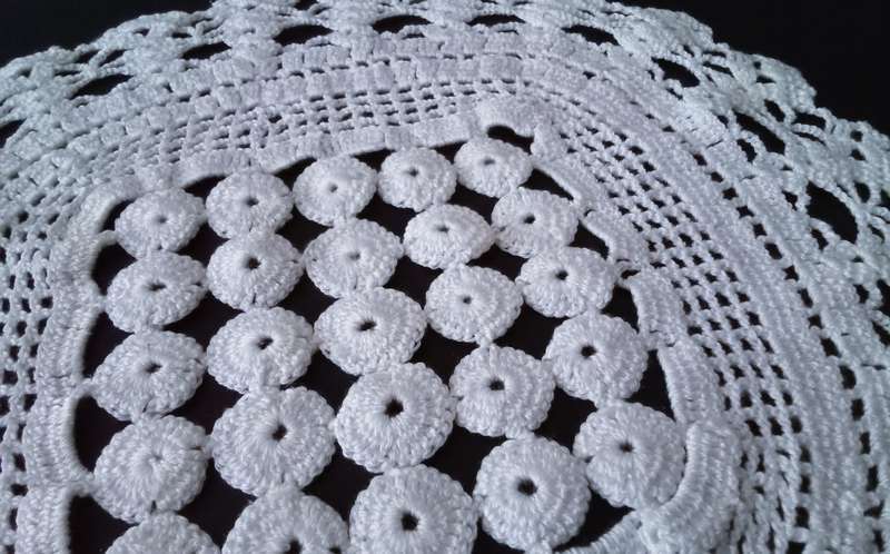 Exquisite white crocheted doily - about 38cms across