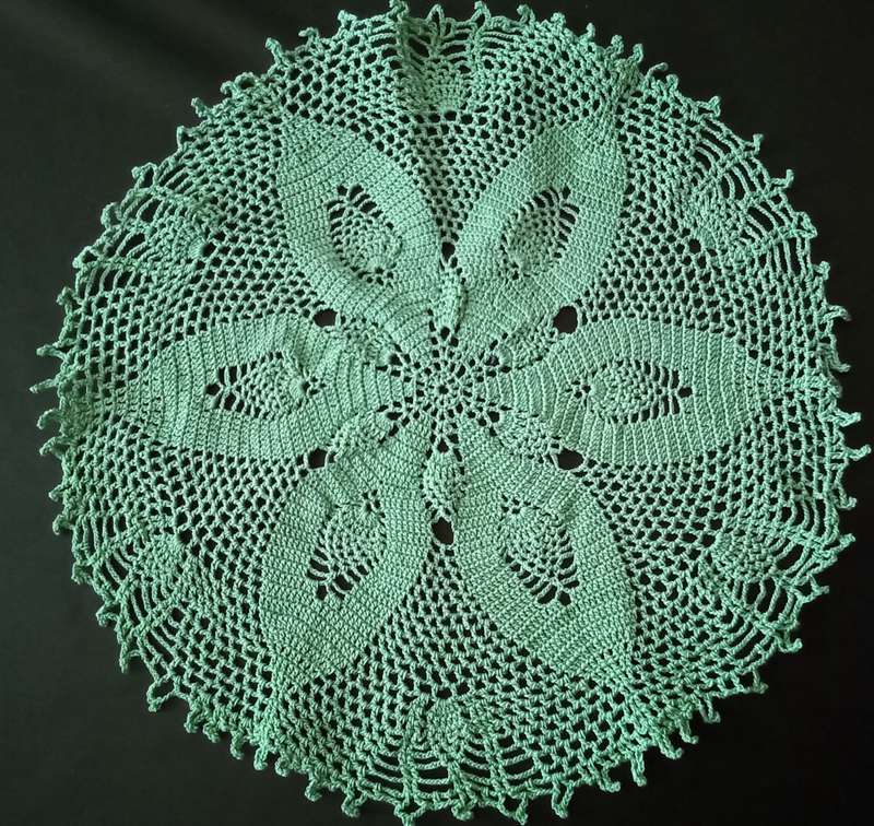 Magnificent detailed green crocheted doily - about 23cms across