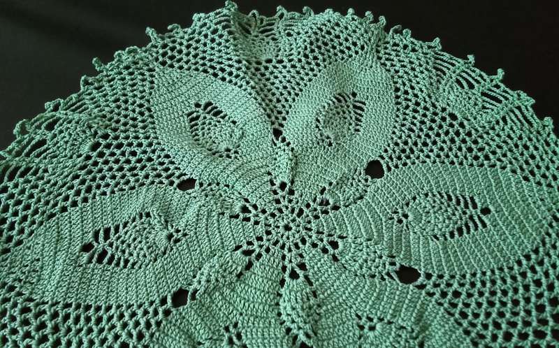 Magnificent detailed green crocheted doily - about 23cms across