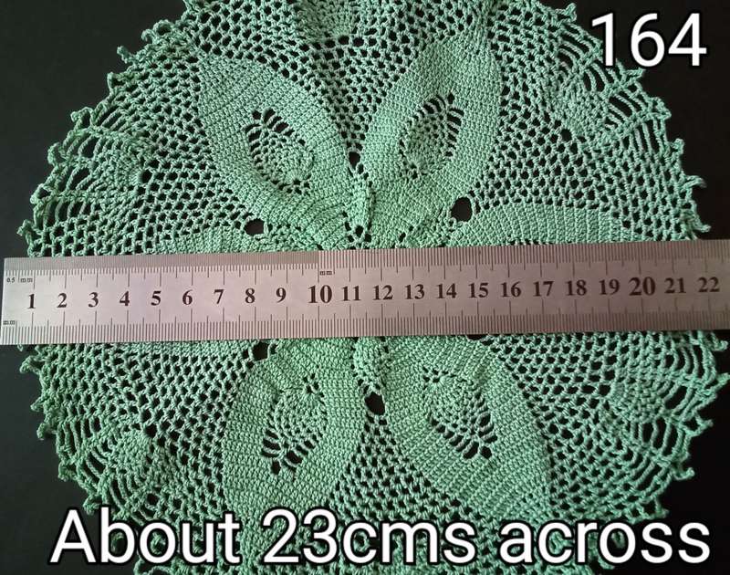 Magnificent detailed green crocheted doily - about 23cms across