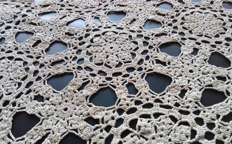 Beautiful detailed beige crocheted doily - about 46cms across