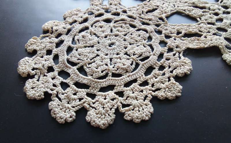 Beautiful detailed beige crocheted doily - about 46cms across