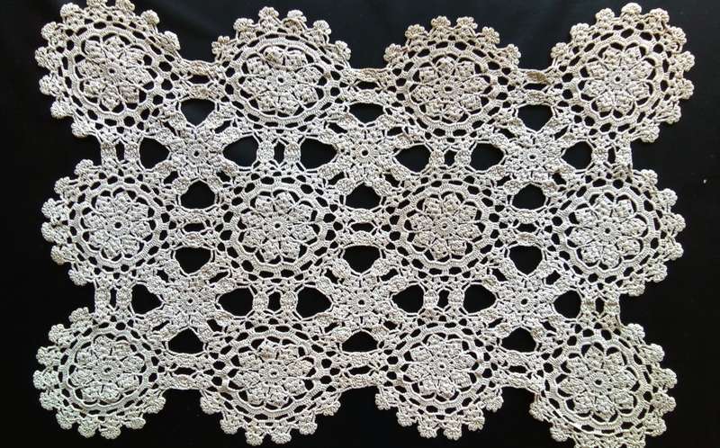 Beautiful detailed beige crocheted doily - about 46cms across