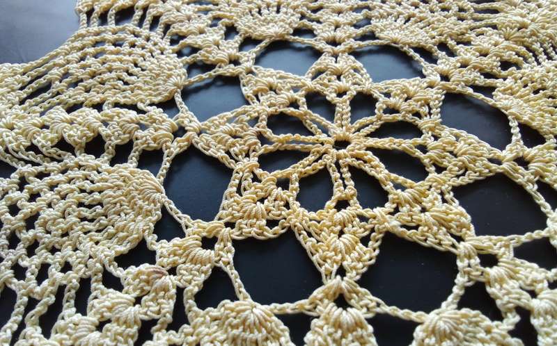 Beautiful soft yellow crocheted doily - about 19cms across