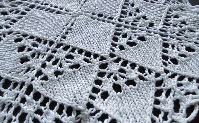 Beautiful white crocheted doily - 22cms across