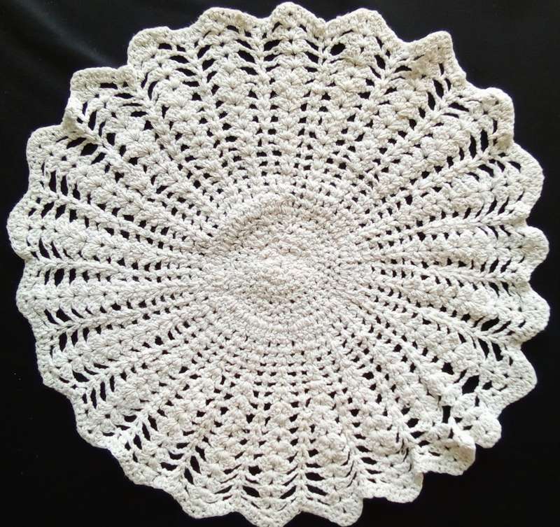 Lovely beige crocheted doily - 30cms across