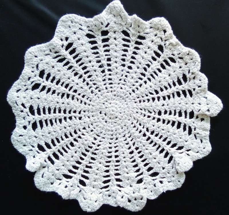 Lovely off-white crocheted doily - 30cms across