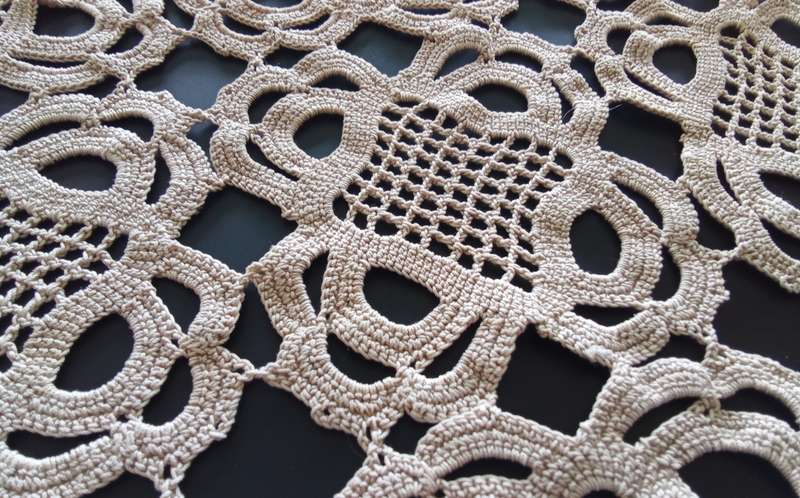 Lovely detailed beige crocheted doily - 32cms across