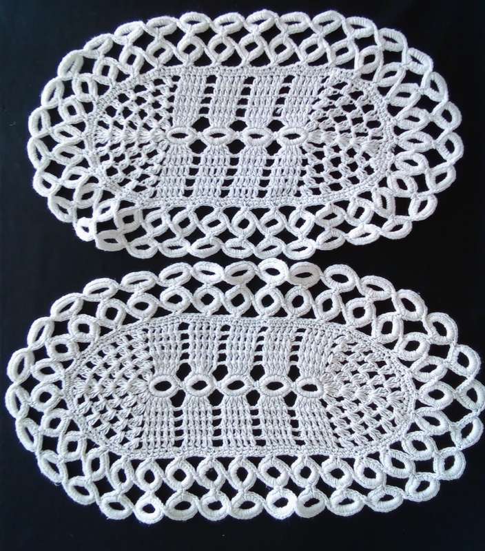 A pair of similar pretty vintage doilies  - 40cms across