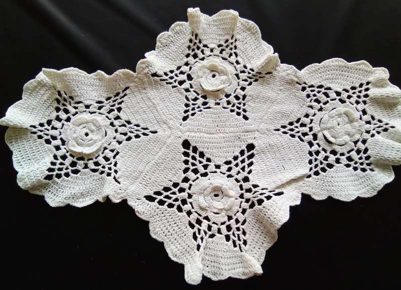Lovely white vintage crocheted doily with flower detail