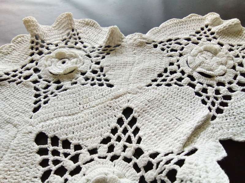Lovely white vintage crocheted doily with flower detail