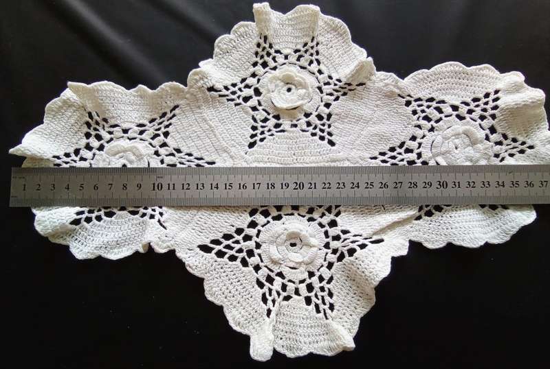 Lovely white vintage crocheted doily with flower detail