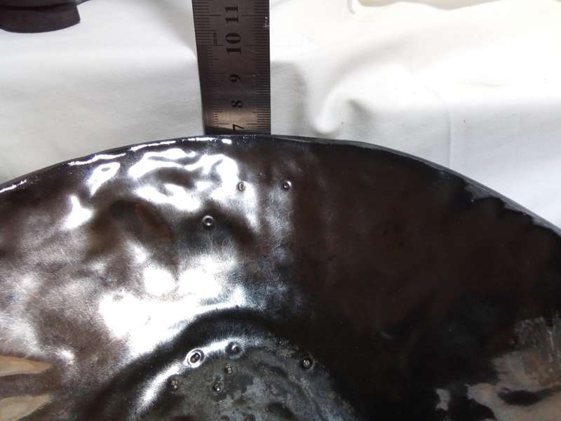 Stunning solid pottery bowl with a dark iridescent glaze inside