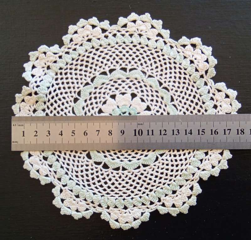 Pretty vintage crocheted doily with peppermint green