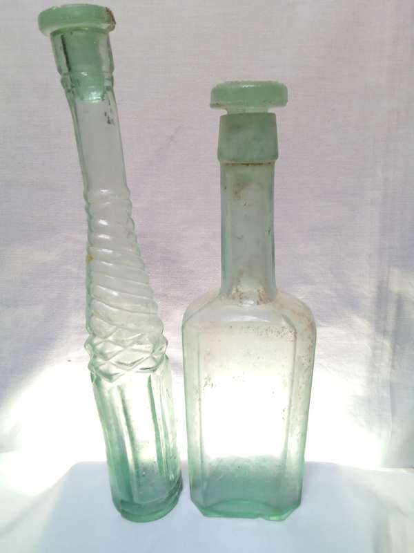 Two Vintage bottles with two glass tops