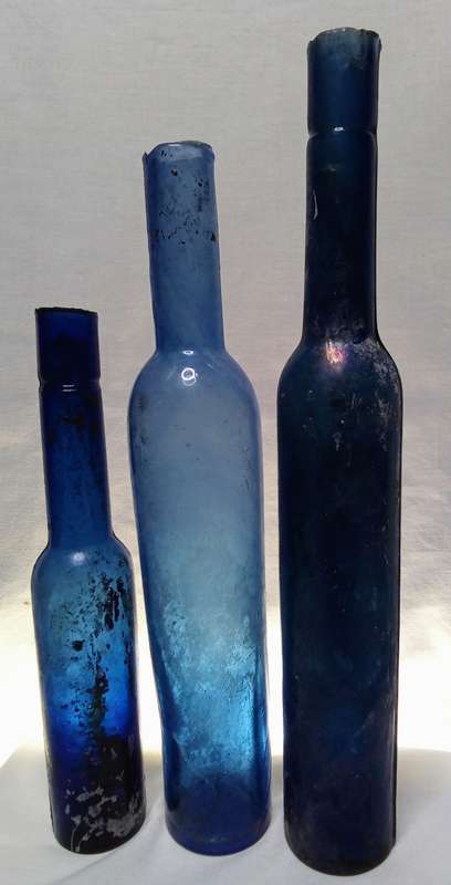 Three blue vintage bottles