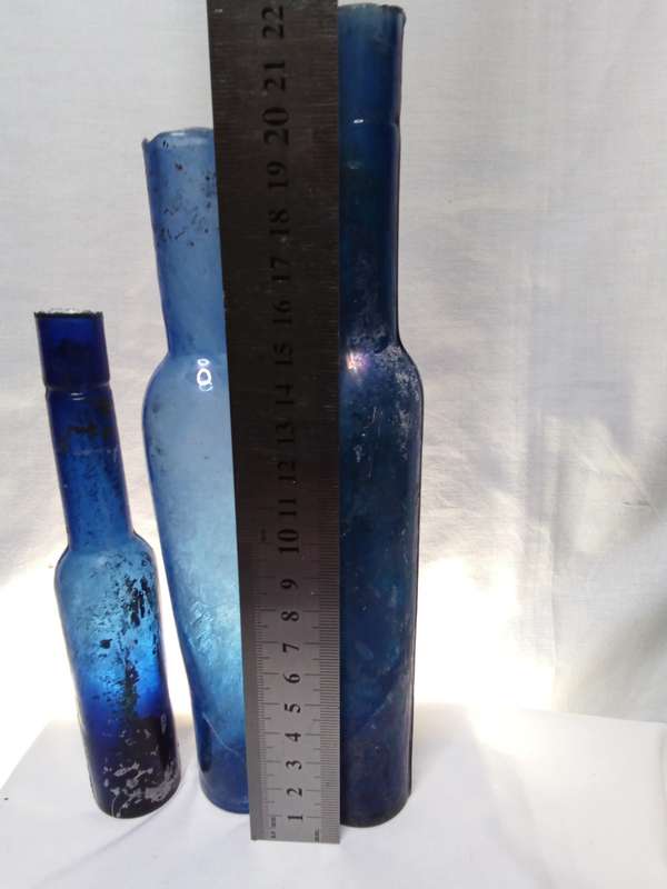 Three blue vintage bottles