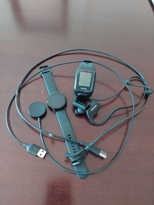 1x TomTom watch with earphones and charger & 1x Samsung Galaxy Watch with charger