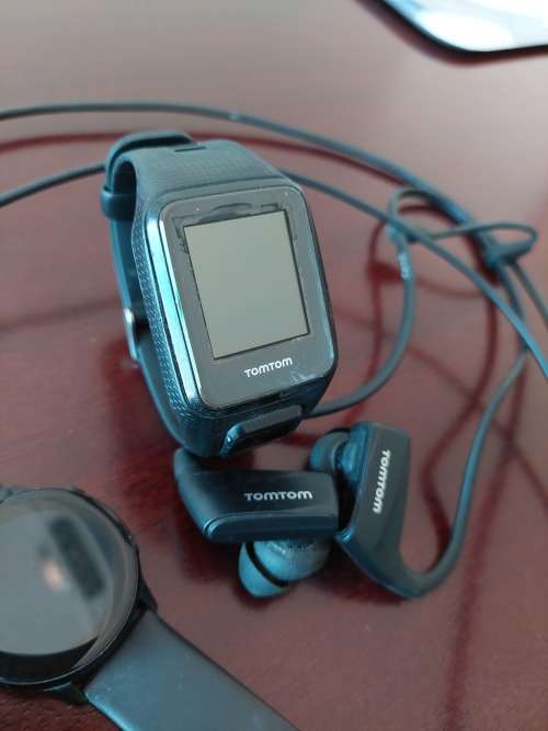 1x TomTom watch with earphones and charger & 1x Samsung Galaxy Watch with charger
