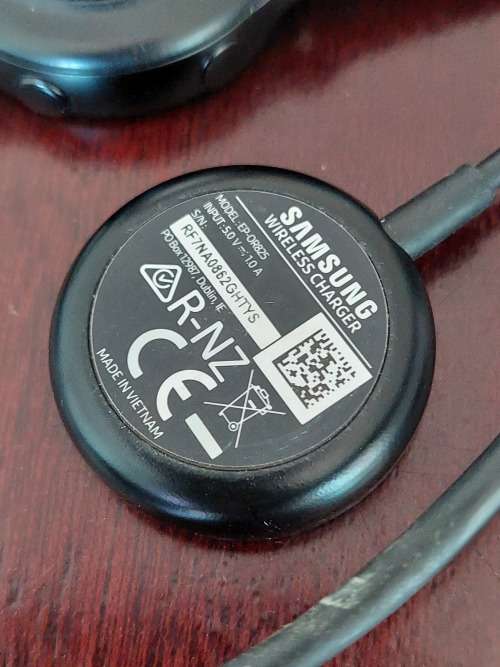 1x TomTom watch with earphones and charger & 1x Samsung Galaxy Watch with charger