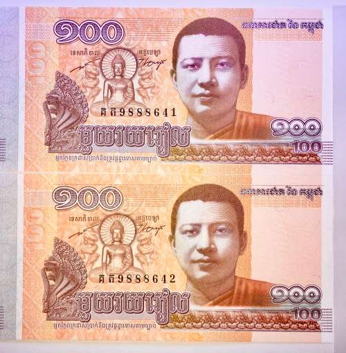 CAMBODIA 100 RIELS IN SEQ 9888641-642 UNC GEM 2014 IN PLASTIC INFO SLEEVE(1 BID TAKES ALL)