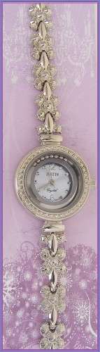 LADIES JUSTIN WATCH WITH SILVER FACE AND FLOATING BALLS