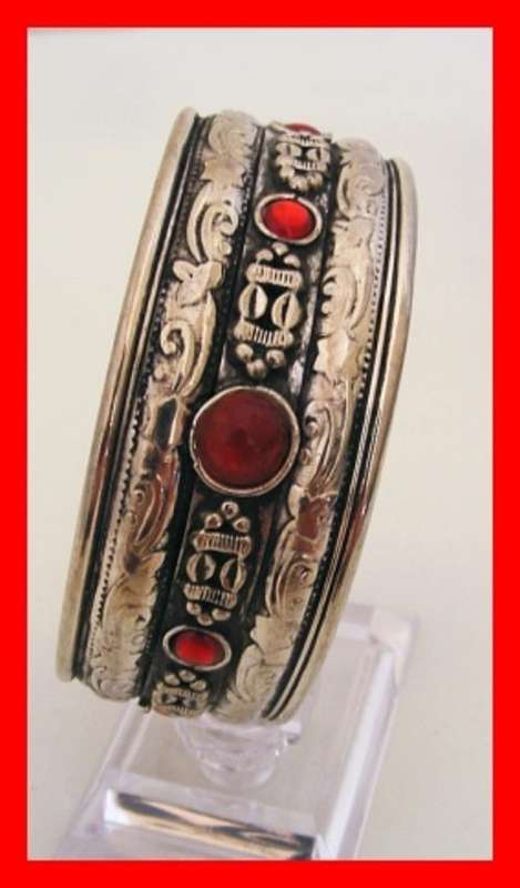 TIBETAN SILVER CUFF BRACELET WITH RED STONES