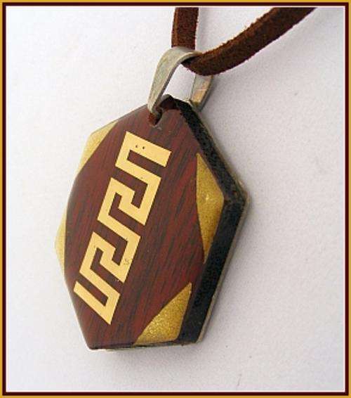 STAINLESS STEEL AND WOOD PENDANT ON A LEATHER CORD