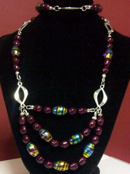 Over the neck long purple and blue necklace