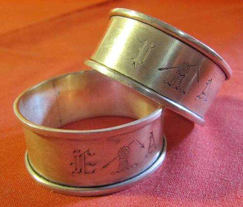 Pair of Hallmarked Silver Serviette Rings with Engraving of a Clenched Fist holding a Broken Arrow