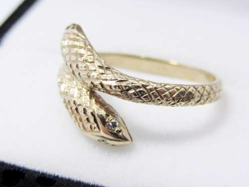 Antique design 9 carat gold ring with a double snake head