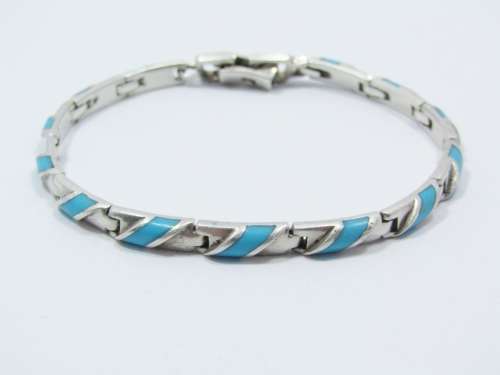 Paneled Bracelet With a Turquoise Inlay in Sterling Silver