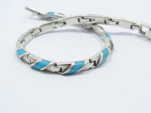 Paneled Bracelet With a Turquoise Inlay in Sterling Silver
