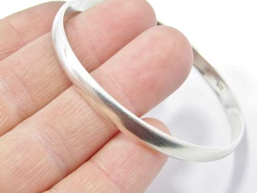 A Lovely Solid  Silver Bangle in Sterling Silver.