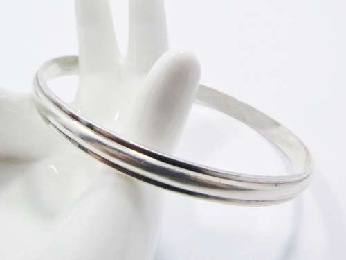A Gorgeous Solid Ribbed Design Bangle in Sterling Silver.