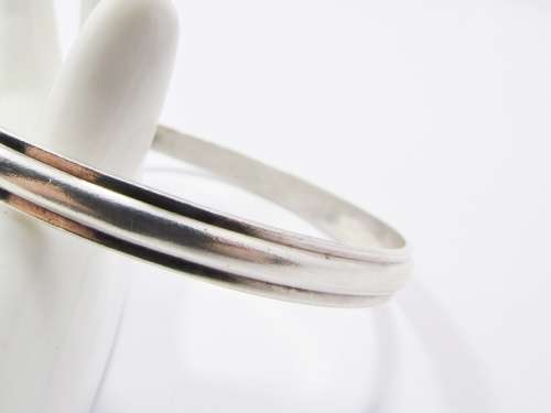 A Gorgeous Solid Ribbed Design Bangle in Sterling Silver.