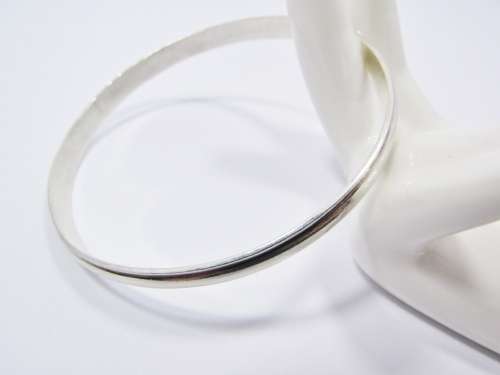 A Gorgeous Solid Ribbed Design Bangle in Sterling Silver.