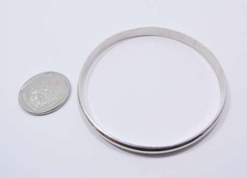 A Gorgeous Solid Ribbed Design Bangle in Sterling Silver.
