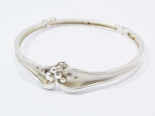 A Beautiful Abstract  Design Hinged Bangle in Sterling Silver