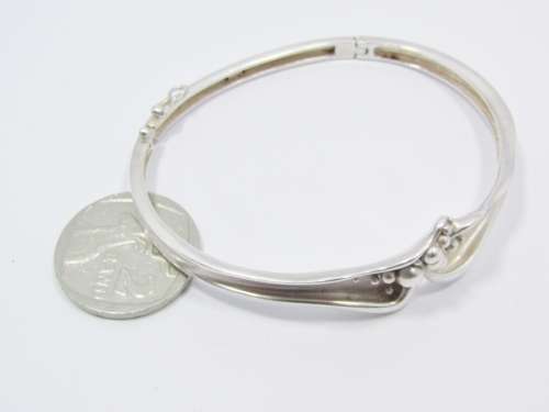 A Beautiful Abstract  Design Hinged Bangle in Sterling Silver
