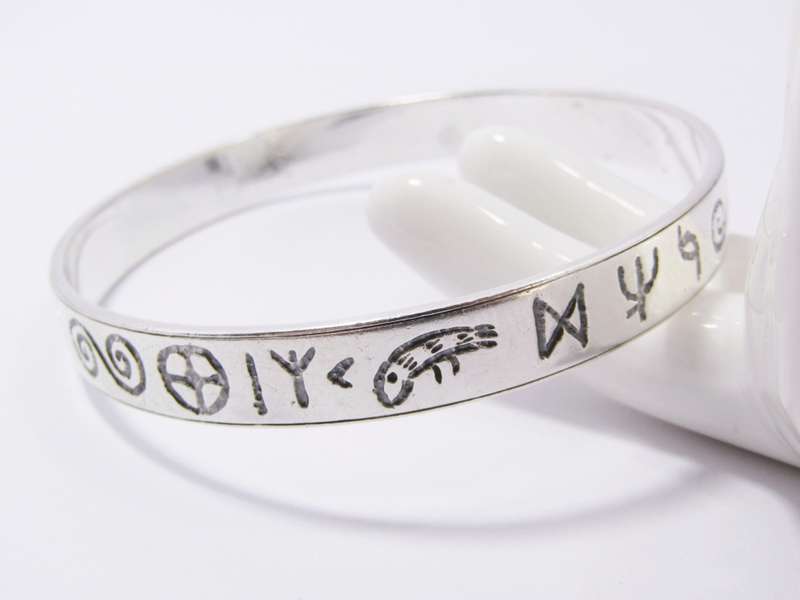 A Stunning Rustic Runic Design Bangle in Sterling Silver.